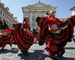 Participants of the Khamoro World Roma Festival dance through the historical centre of Prague